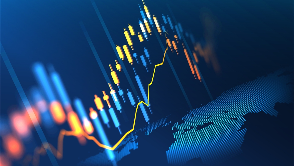 A financial analyst reviewing profitability reports, cash flow charts, and tax planning documents to track a Canadian business’s financial health.